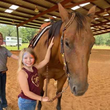 A covered riding arena in Nacogdoches TX at Pine Top Stables and Grounds