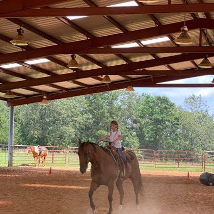 A covered riding arena in Nacogdoches TX at Pine Top Stables and Grounds