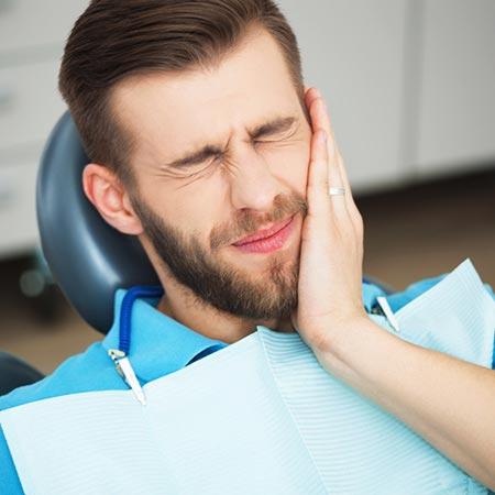 young man dental pain