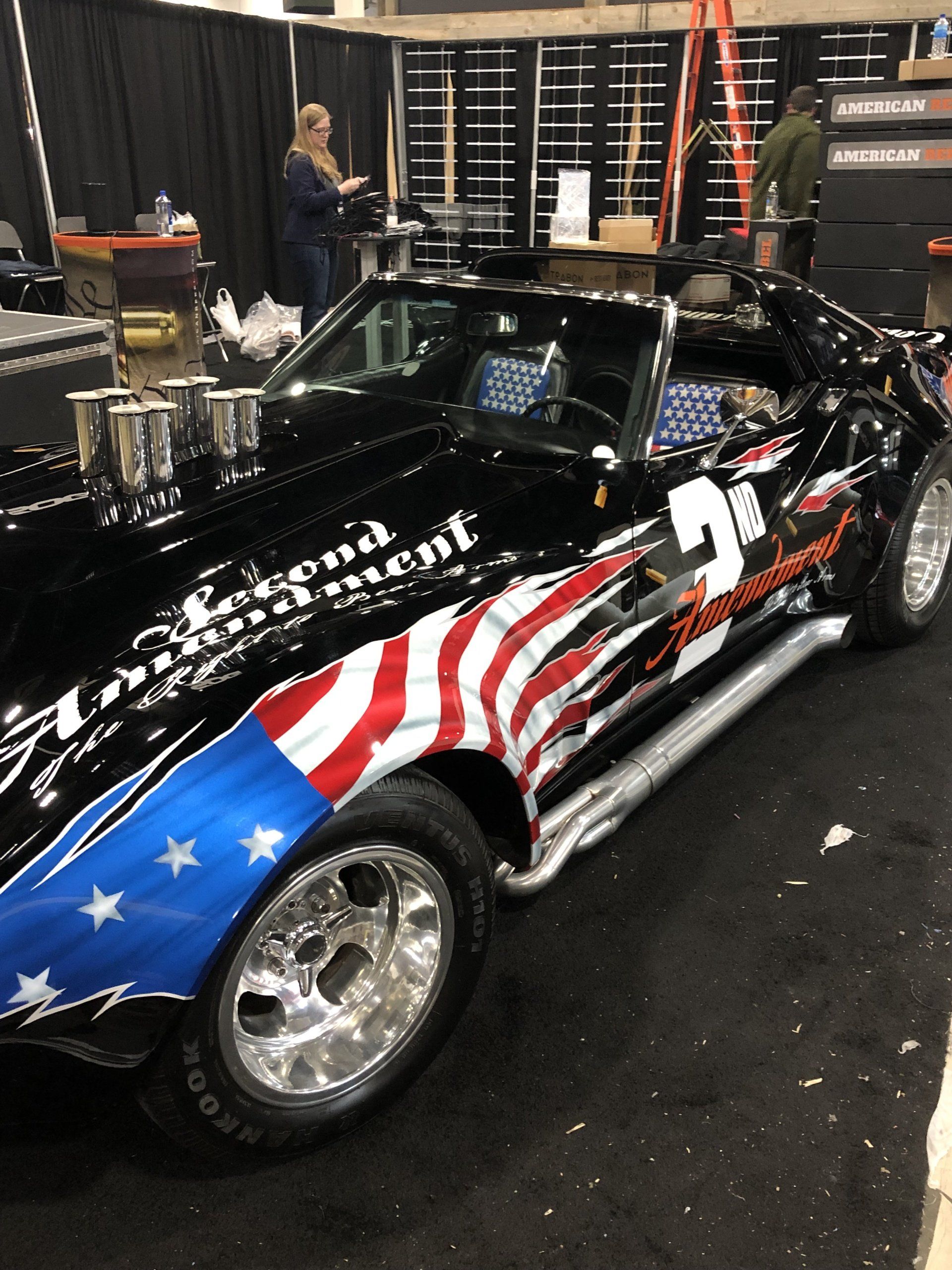 A black car with an american flag painted on it