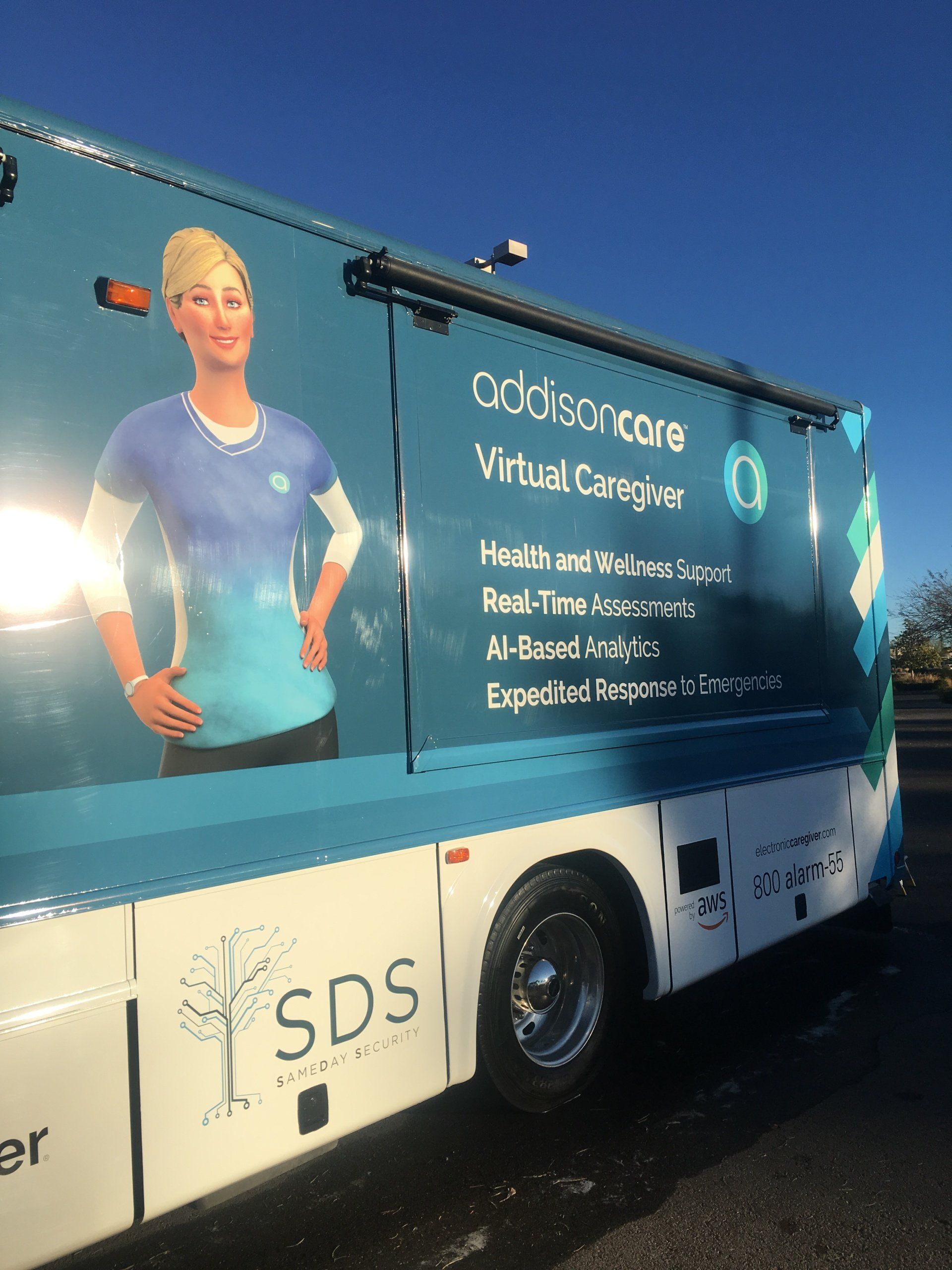 A blue and white van with the word sds on the side