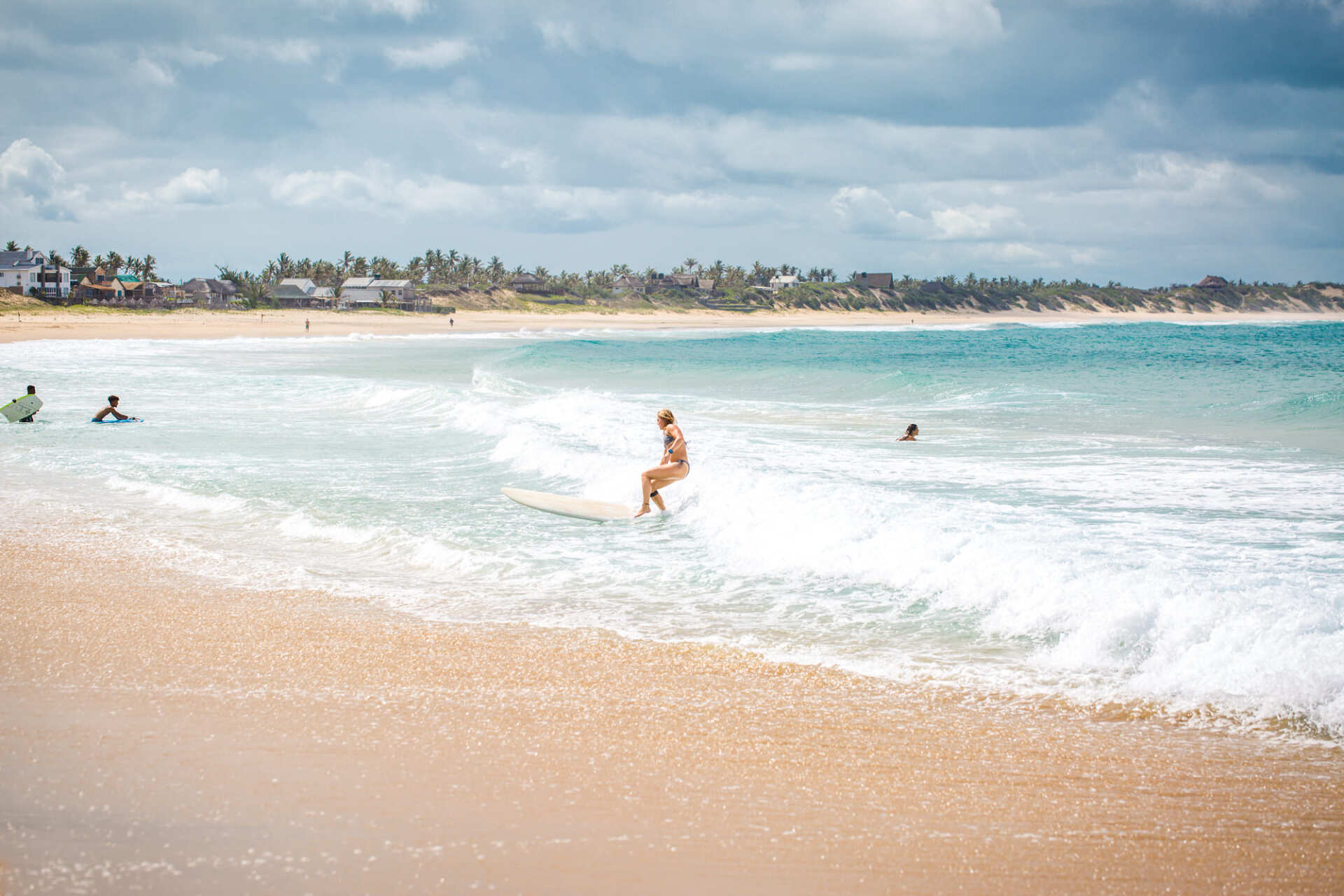People surfing on Tofo Beach