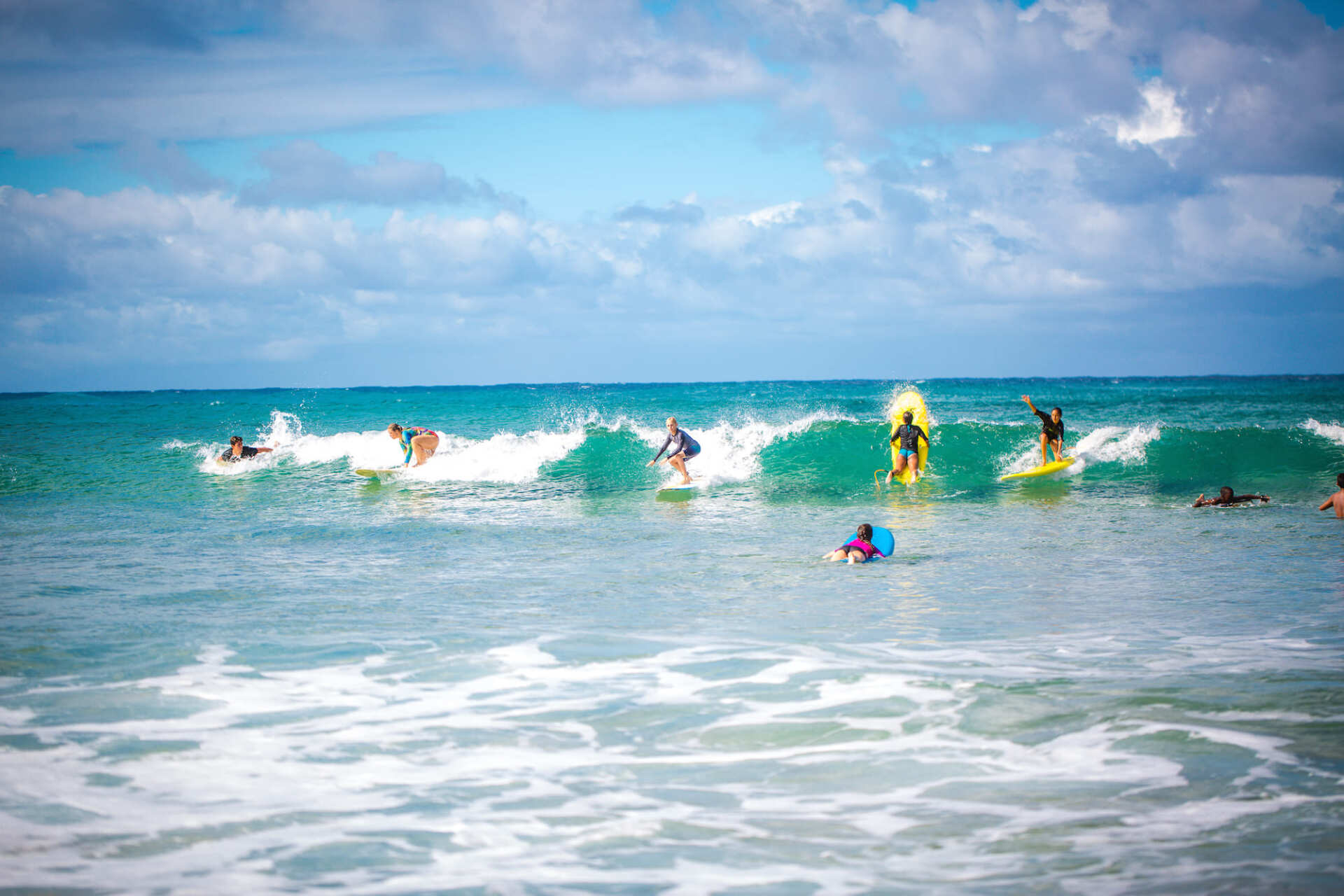 People surfing at Tofo Beach
