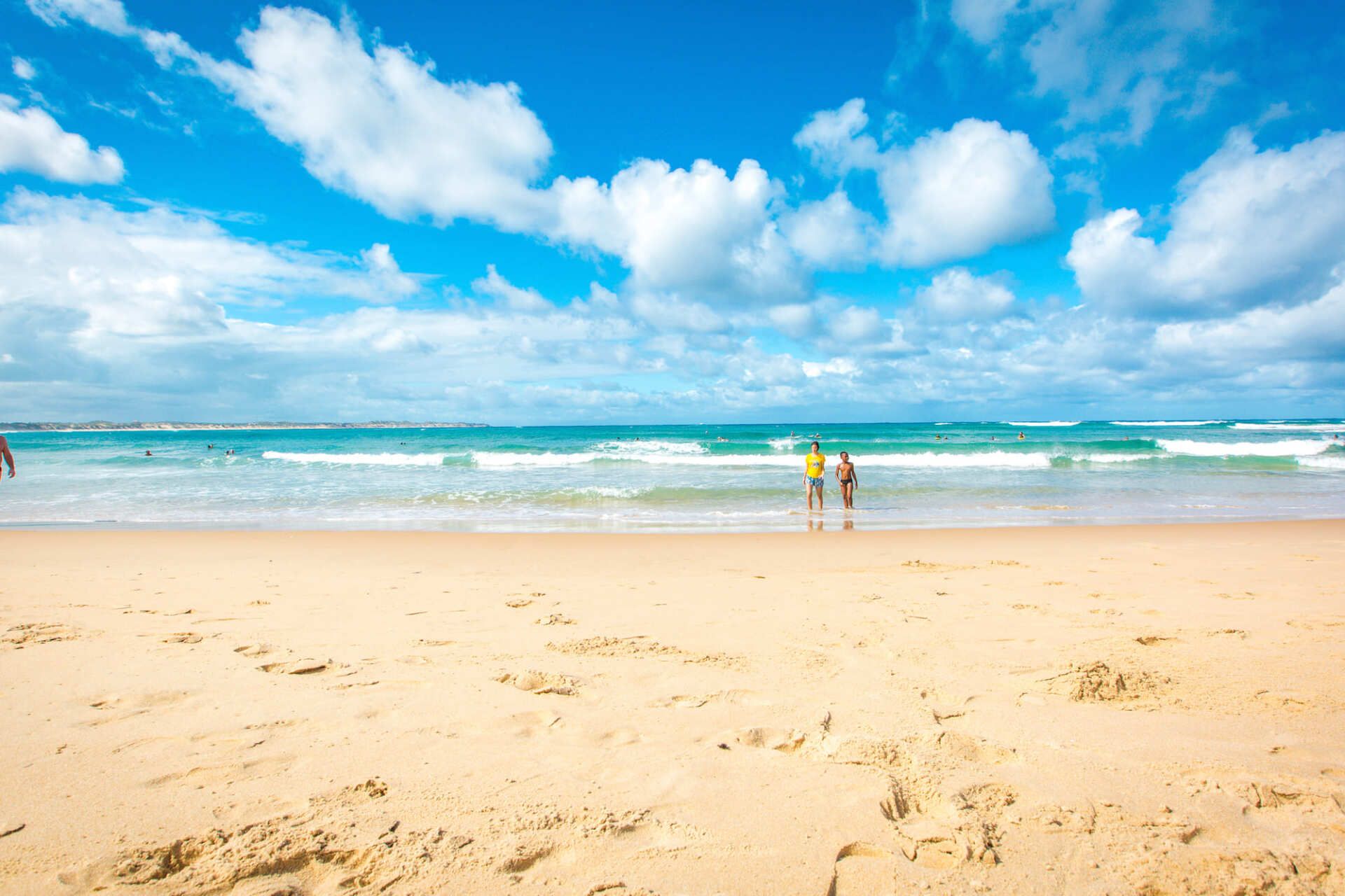 People walking on Tofo Beach
