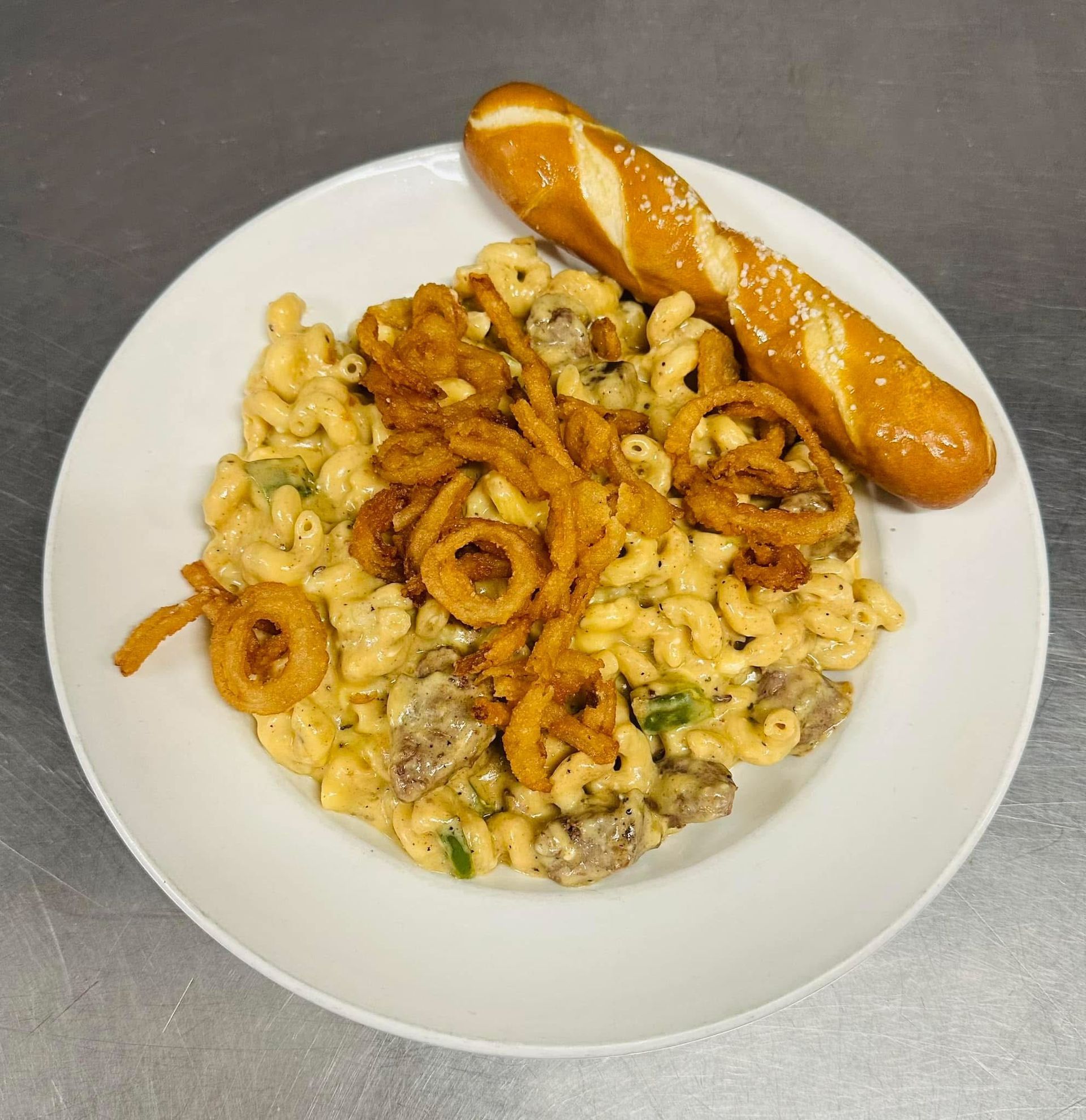 A white plate topped with chicken mashed potatoes and asparagus