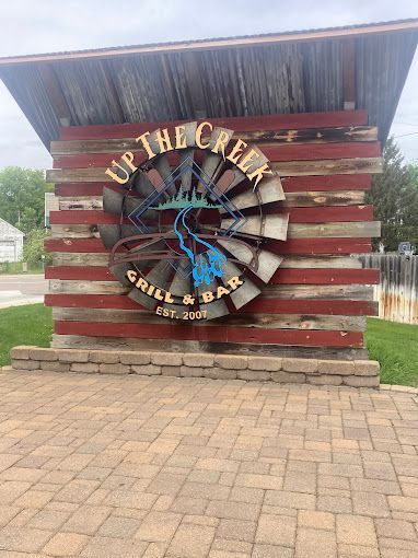 A restaurant with a lot of wine glasses on the tables