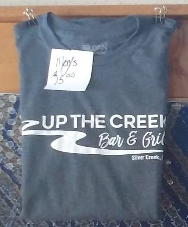 A t-shirt that says ' up the creek bar & grill ' on it