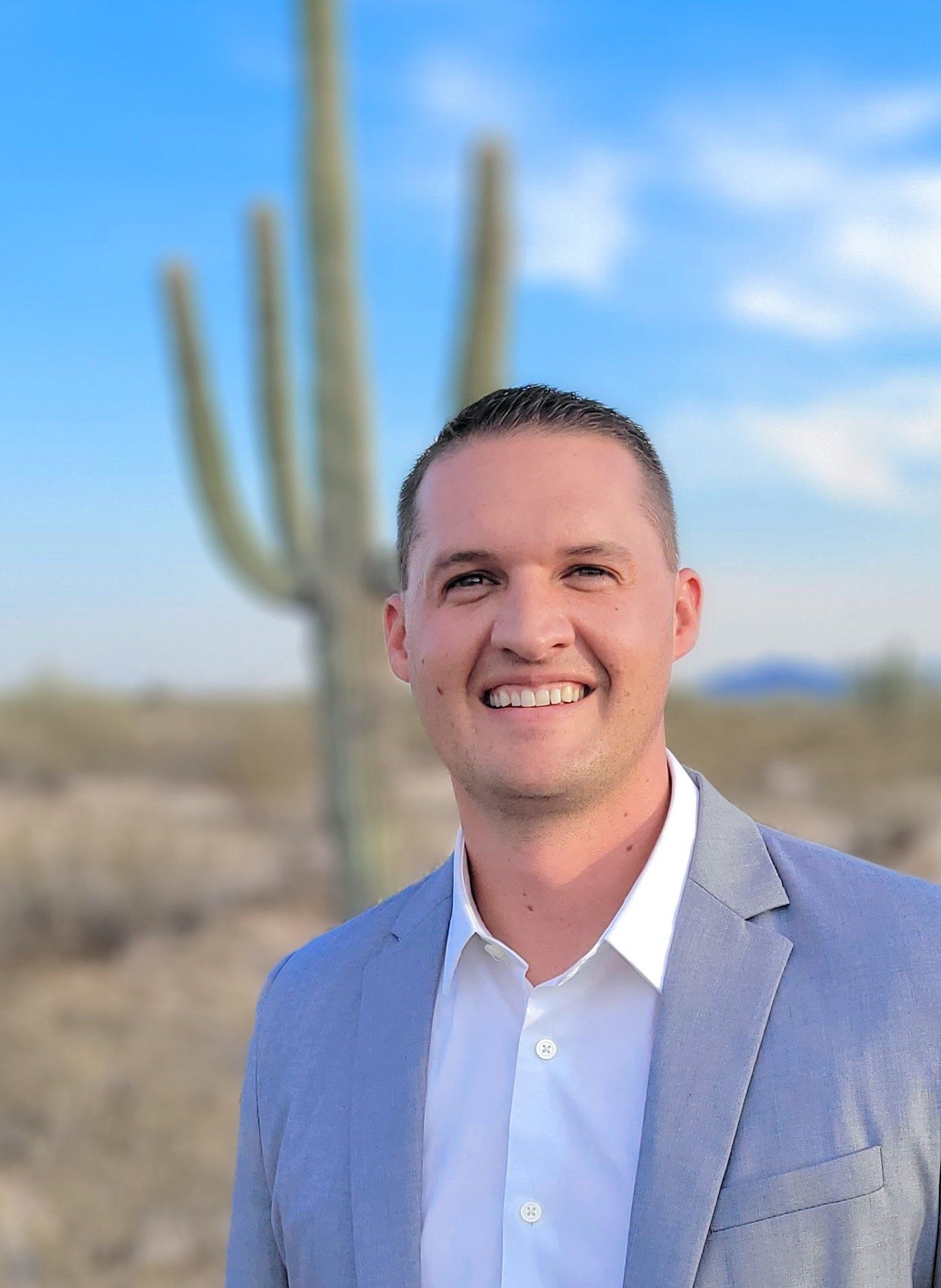 Brian Kreger Realtor in front of a saguaro located in Marana, AZ
