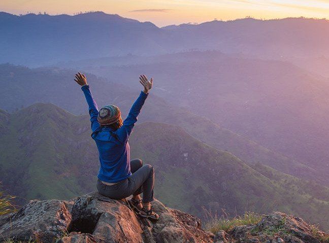 Woman on mountain bike, symbolizing Physical Therapy in Anchorage, AK.