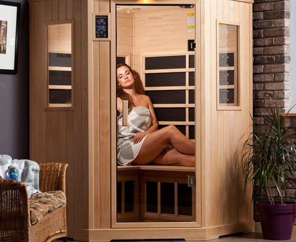 Woman relaxing in the infrared sauna.