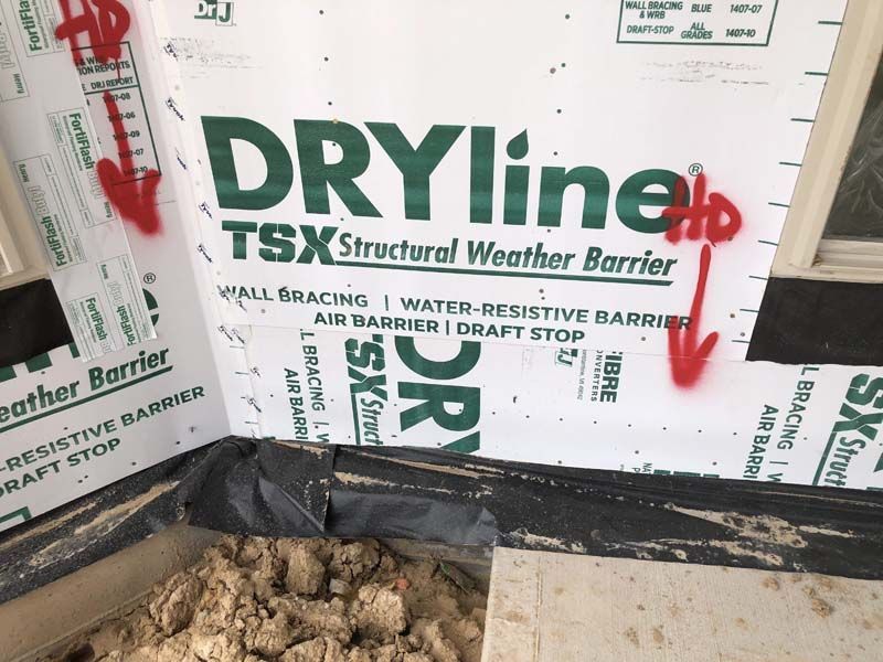 A dryline tsx structural weather barrier is being installed on a wall