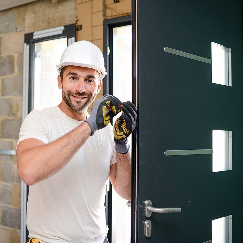 Man Installing Door — Glass & Aluminium Services in Emerald, QLD