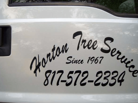 Horton Tree Service logo and phone number on a white vehicle door
