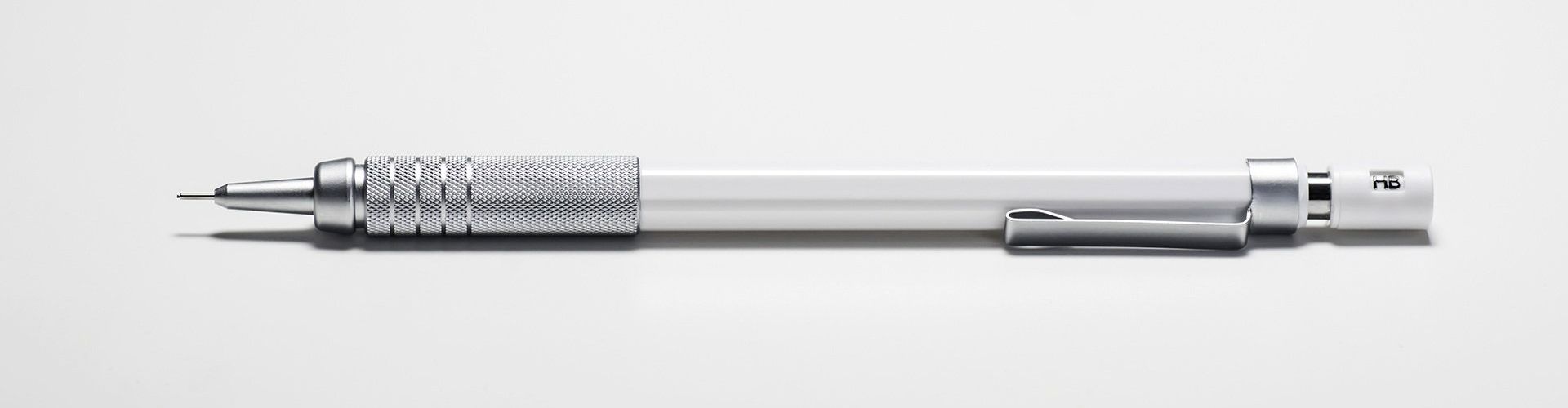 silver and white mechanical pencil with a clip on the end