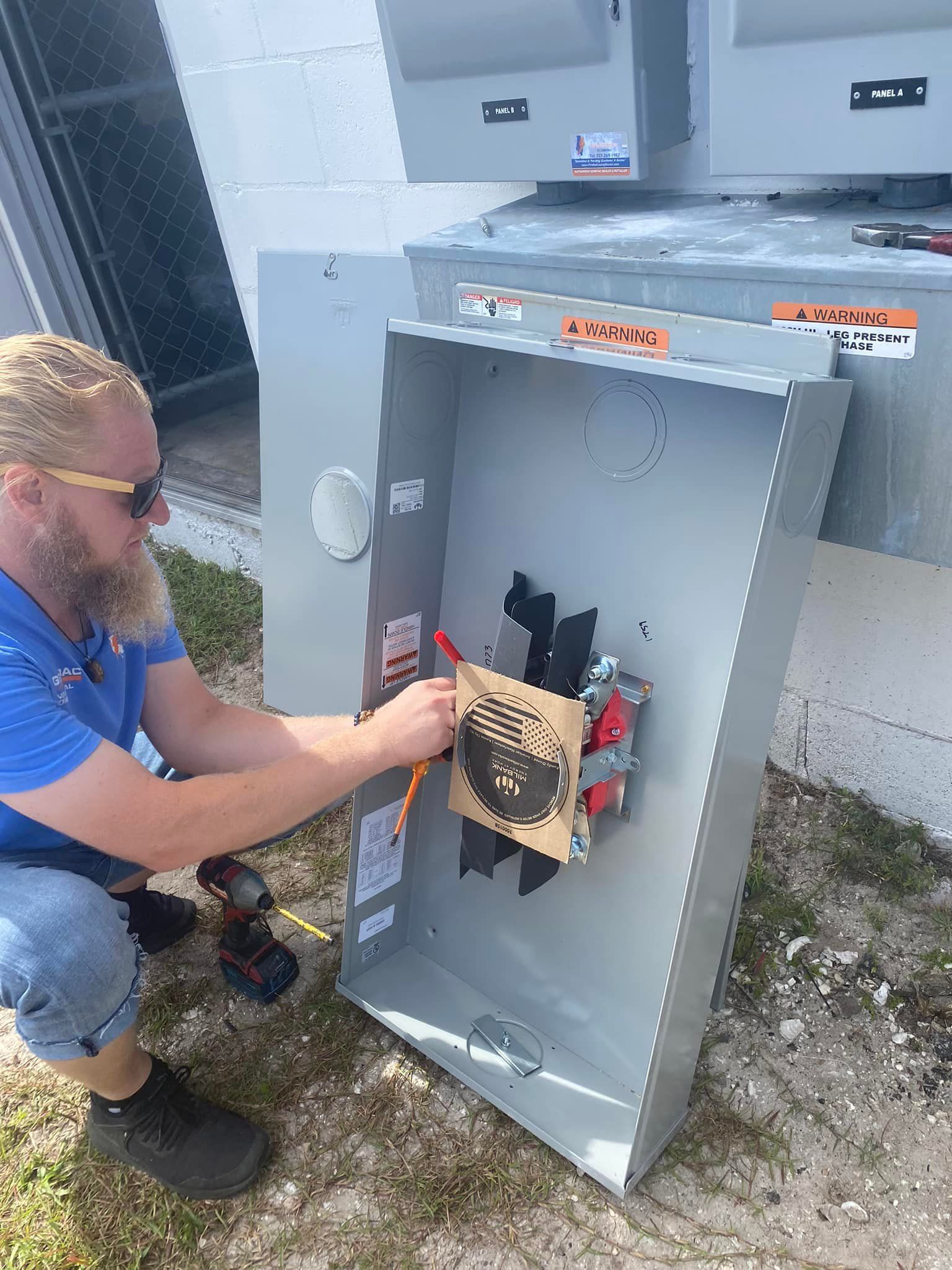 a man fixing an electrical panel