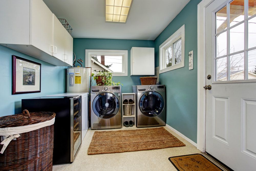 A Laundry Room with Two Washers and Two Dryers — JWB Joinery in Ingham, QLD