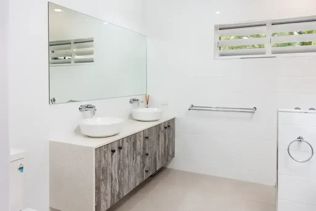 A Bathroom with Two Sinks and A Large Mirror — JWB Joinery in Aitkenvale, QLD