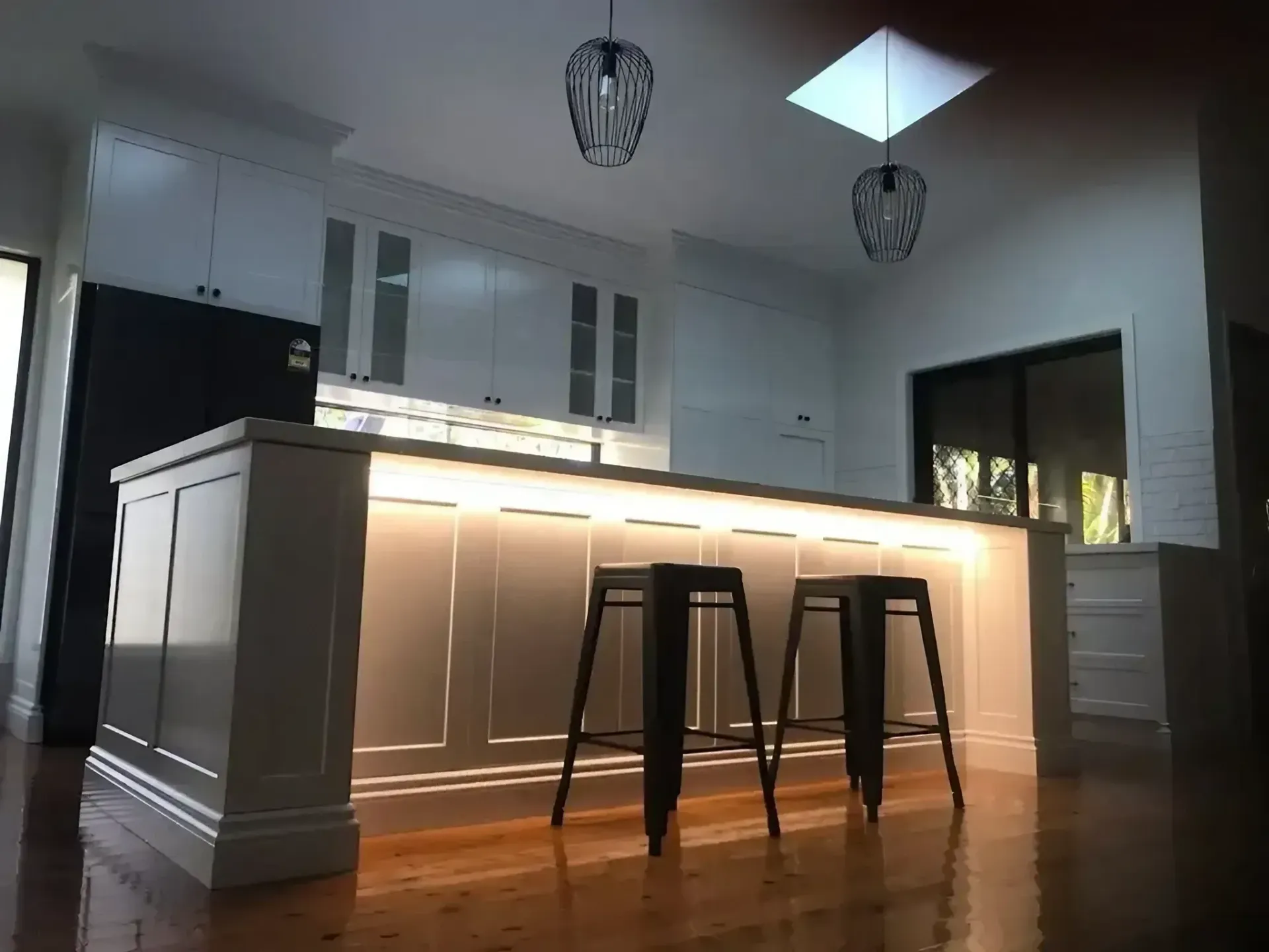 A Kitchen with A Large Island and Stools — JWB Joinery in Aitkenvale, QLD