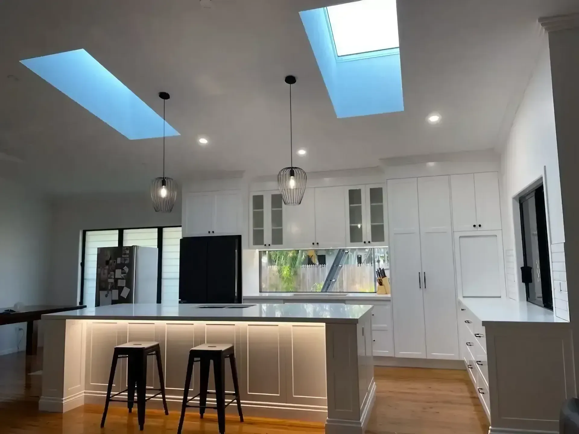 A Kitchen with A Large Island and Two Skylights Above It — JWB Joinery in Aitkenvale, QLD
