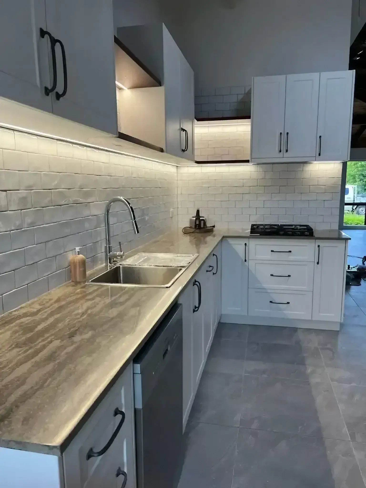 A Kitchen with White Cabinets , a Sink , and A Dishwasher — JWB Joinery in Aitkenvale, QLD