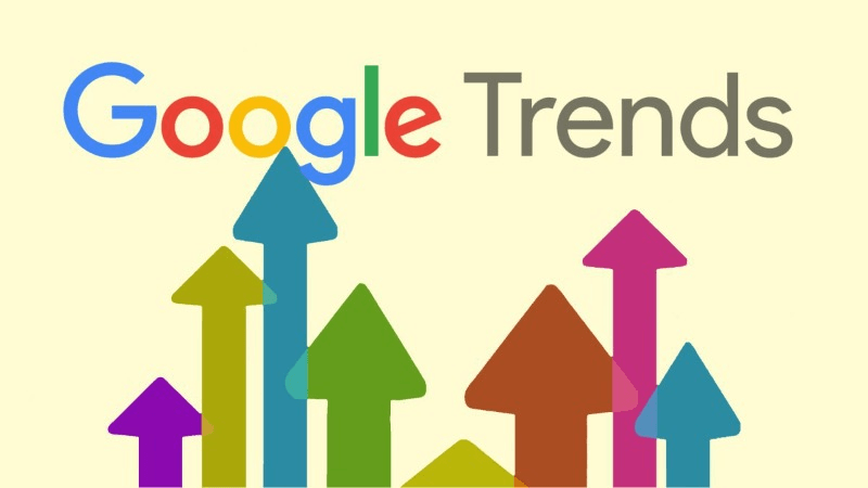 Un logo Google Trends avec des flèches colorées pointant vers le haut