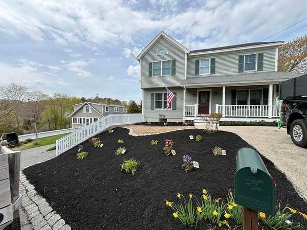 A large house with a mailbox in front of it.