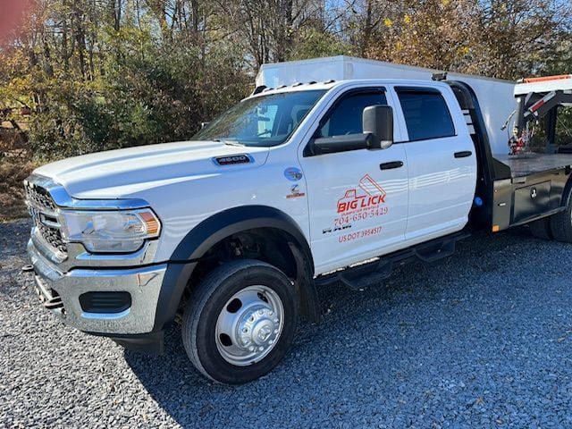 The Big Lick Dumpster Rentals of Oakboro, NC branded dumpster delivery truck.
