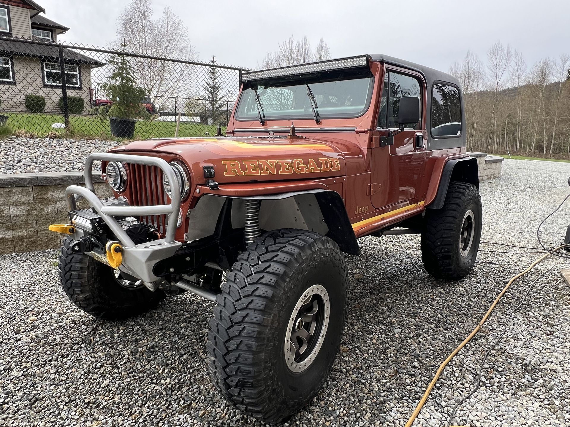 A Red Truck Parked in Front of BM Automotive in Pitt Meadows, BC