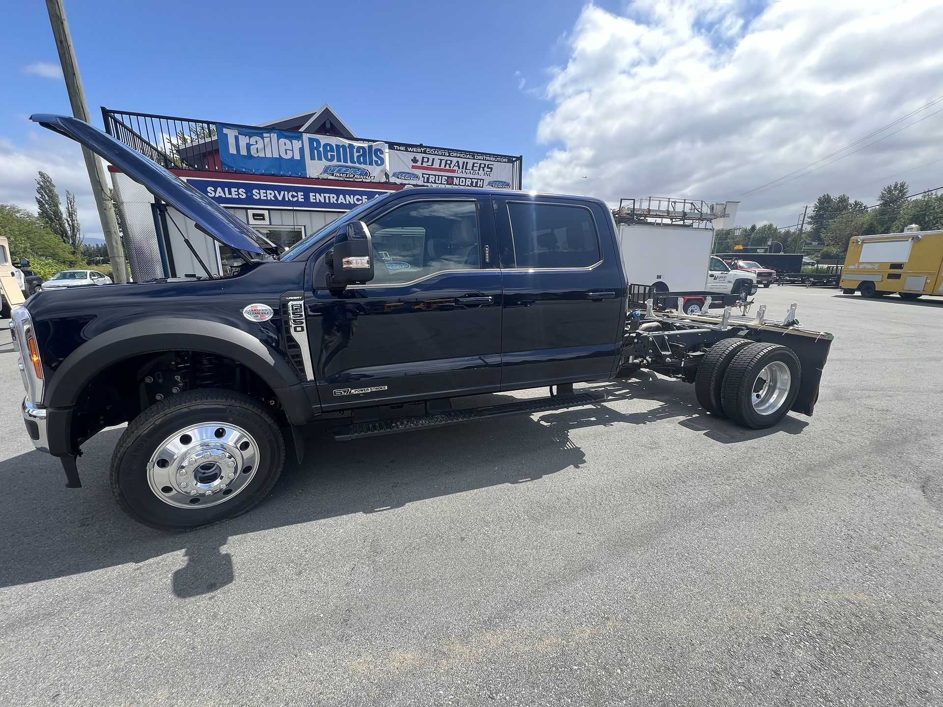 A Black Pickup Truck Trailer with Open Hood - DBM Automotive