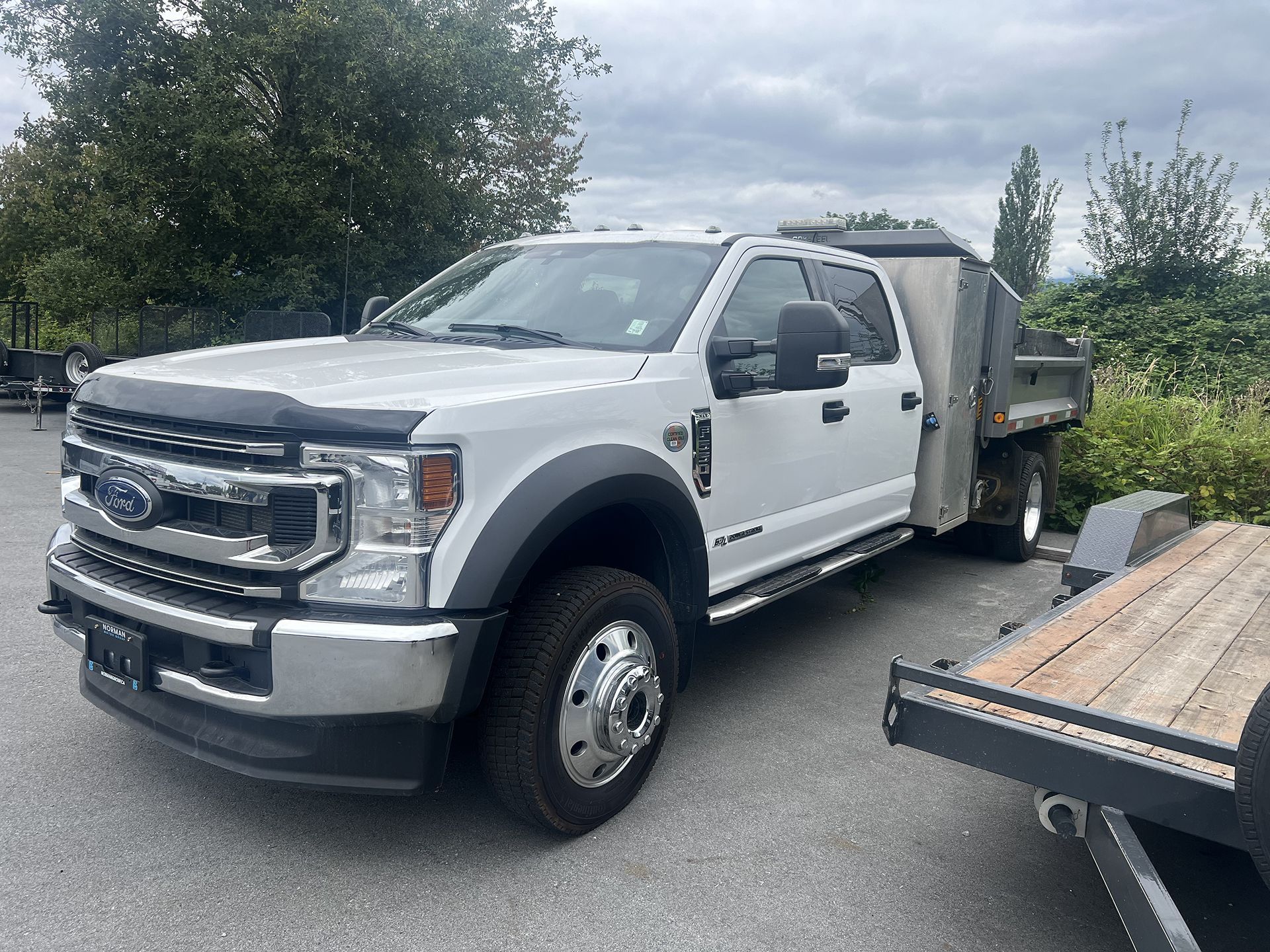 A Big White Pickup Trailer Parked at Our Parking in Pitt Meadows, BC - DBM Automotive