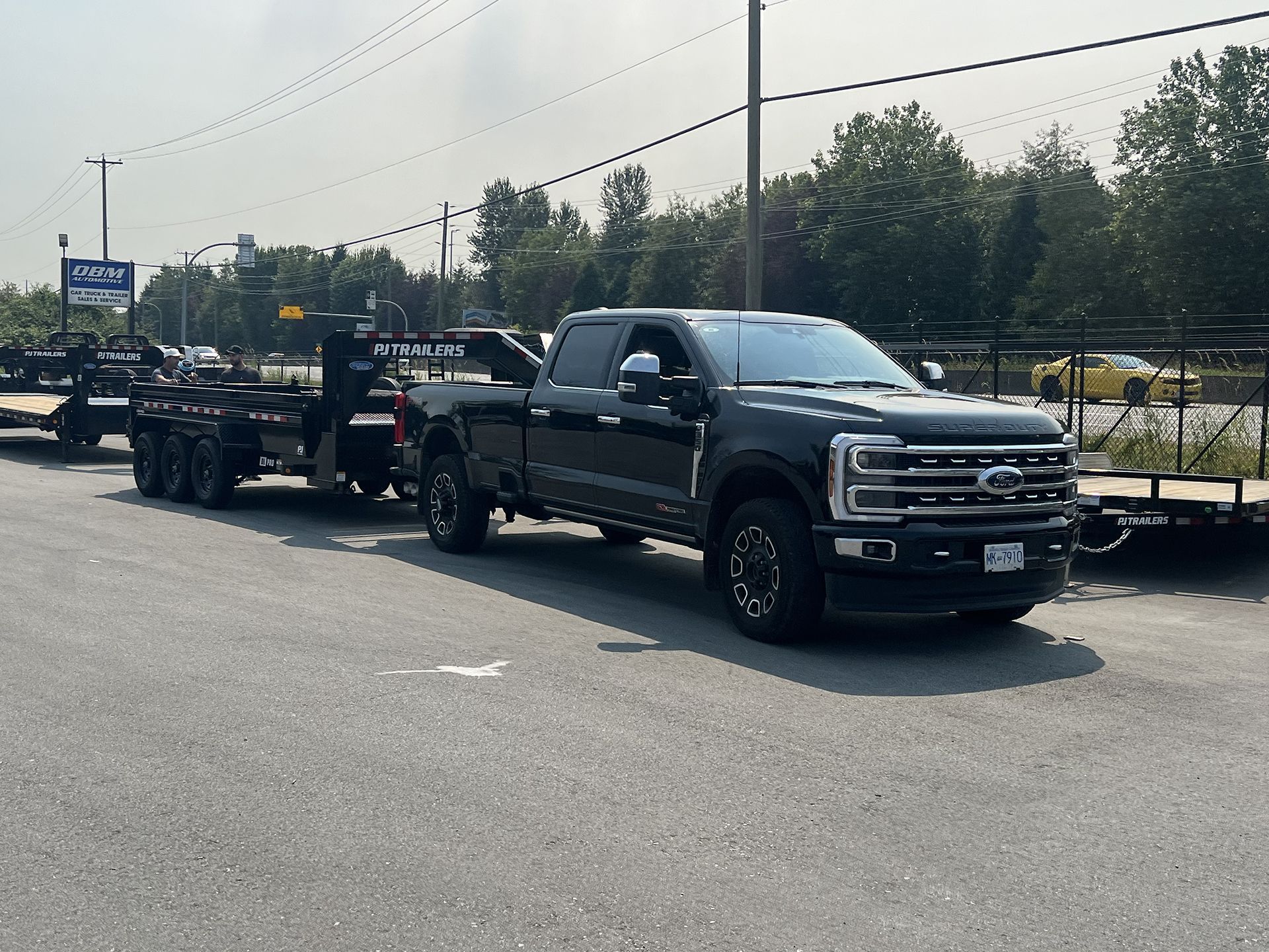 Black Pickup Truck Trailer Parked at our Parking Lot in Pitt Meadows, BC - DBM Automotive