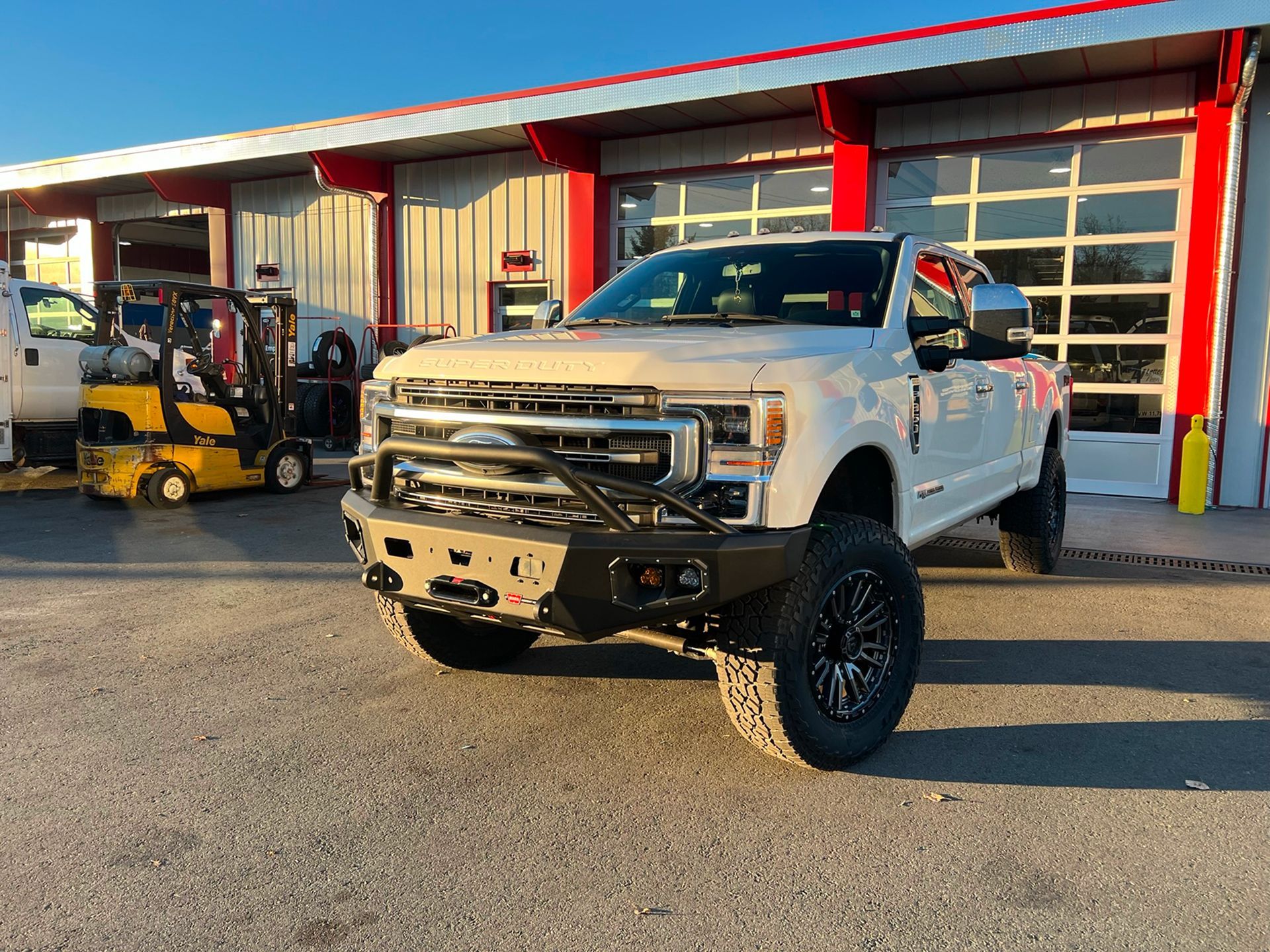 A White Truck Parked in Front of DBM Automotive in Meadows, BC