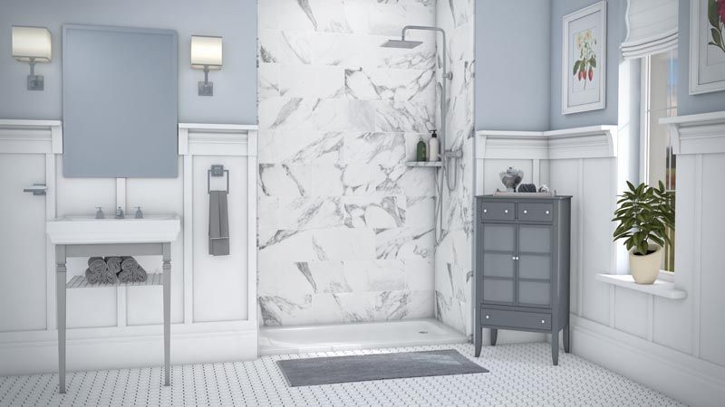 Bathroom with marble shower, blue walls, white paneling, gray cabinet, and plants.