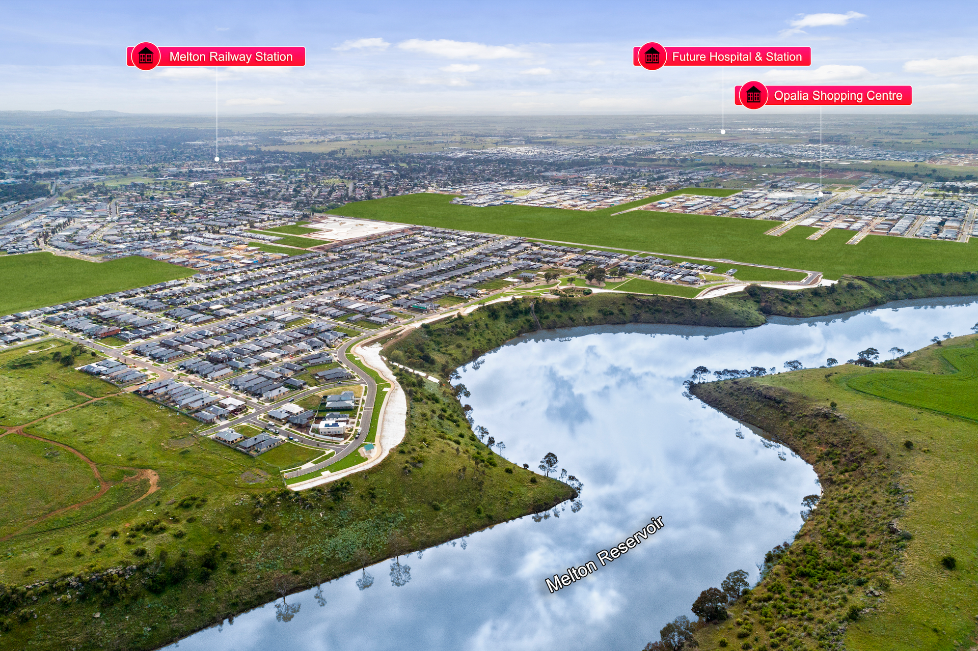 An aerial view of a river with a city in the background.