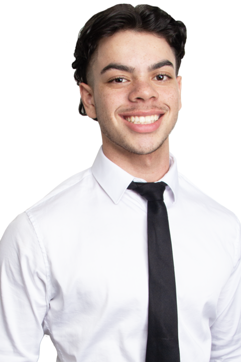 A young man wearing a white shirt and black tie is smiling