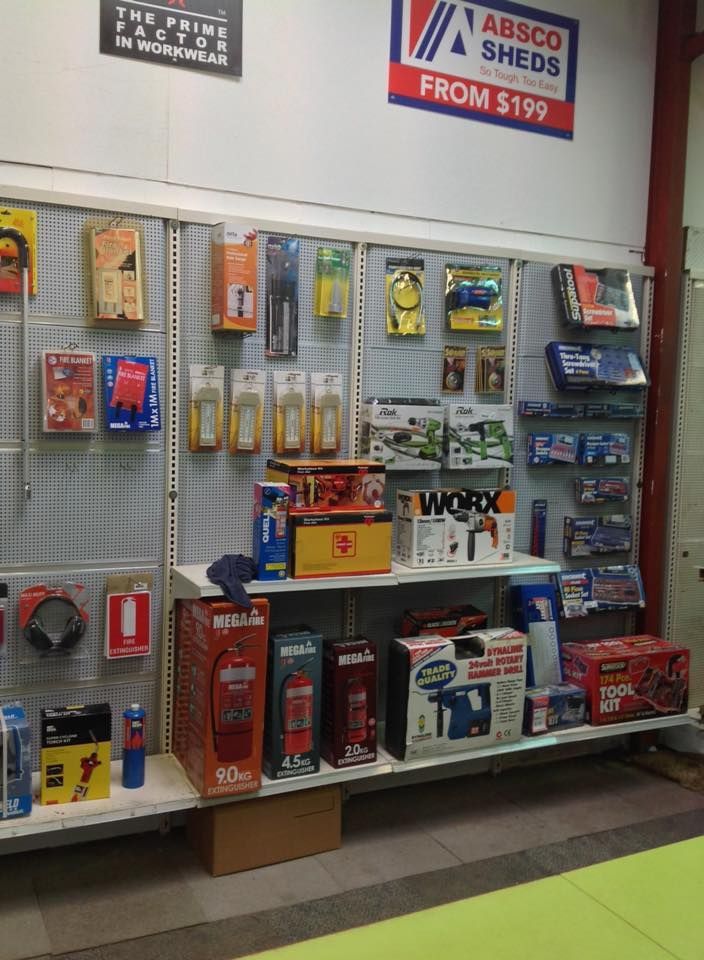 A wall with a sign that says absco sheds from $ 199