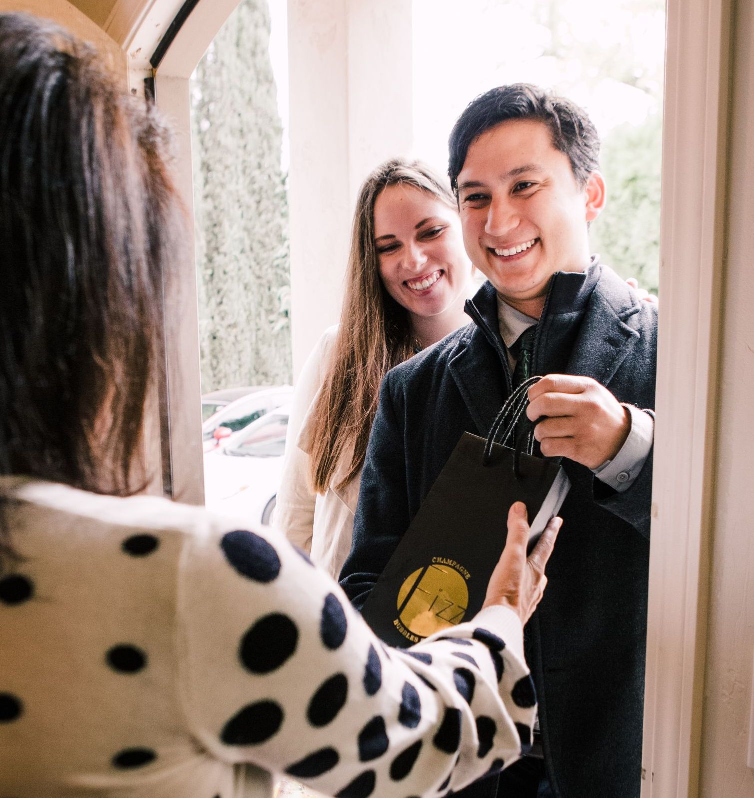 champagne being gifted at a home party.