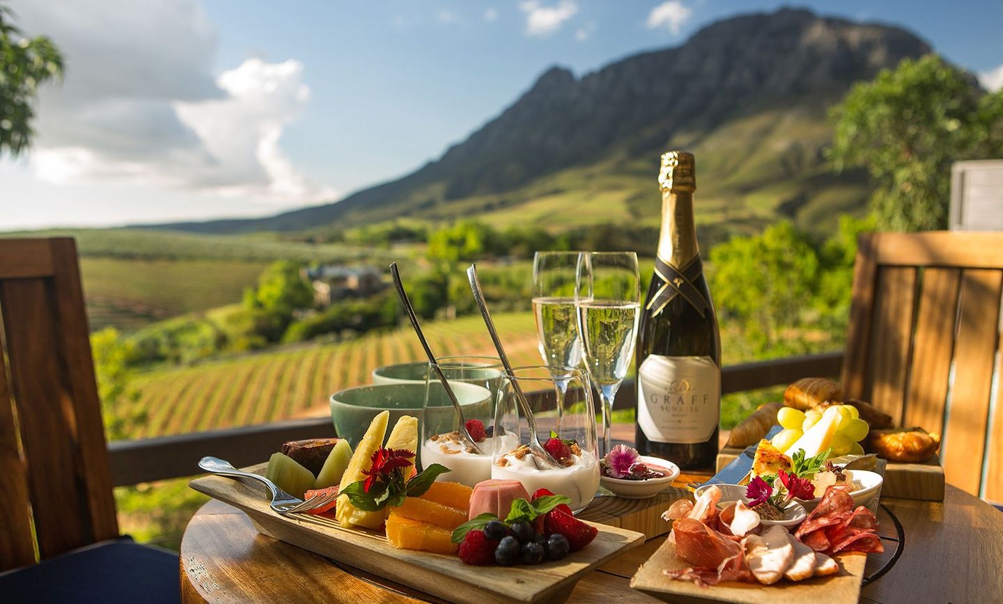 Promotional banner showcasing a journey through South Africa's legendary sparkling wine regions, featuring scenic vineyards and exquisite sparkling wines