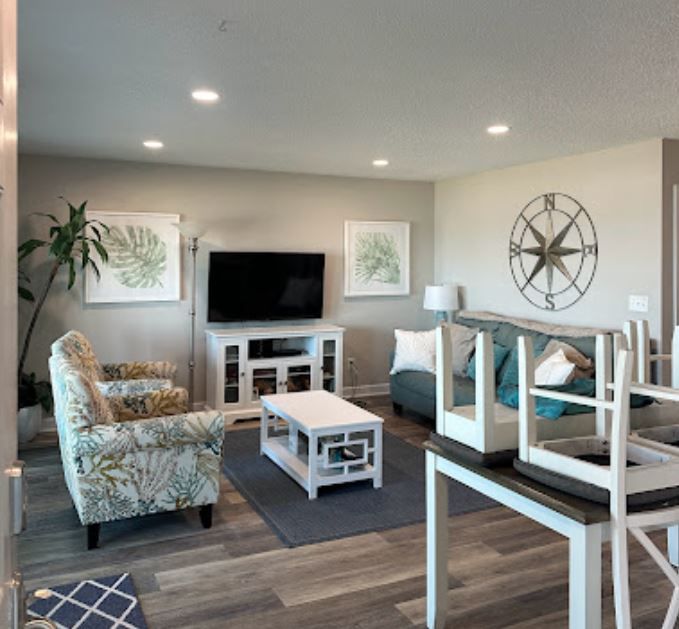 A living room with a couch and a television