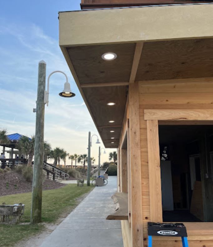 A wooden building with a ladder in front of it