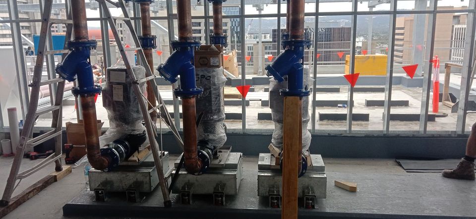Man Fitting Gas Boiler — Jason Morris Plumbing & Gas Fitting in Hackham, SA