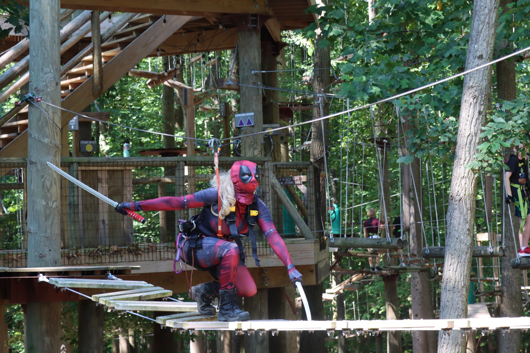 Deadpool climbing on high ropes course for trek or treat