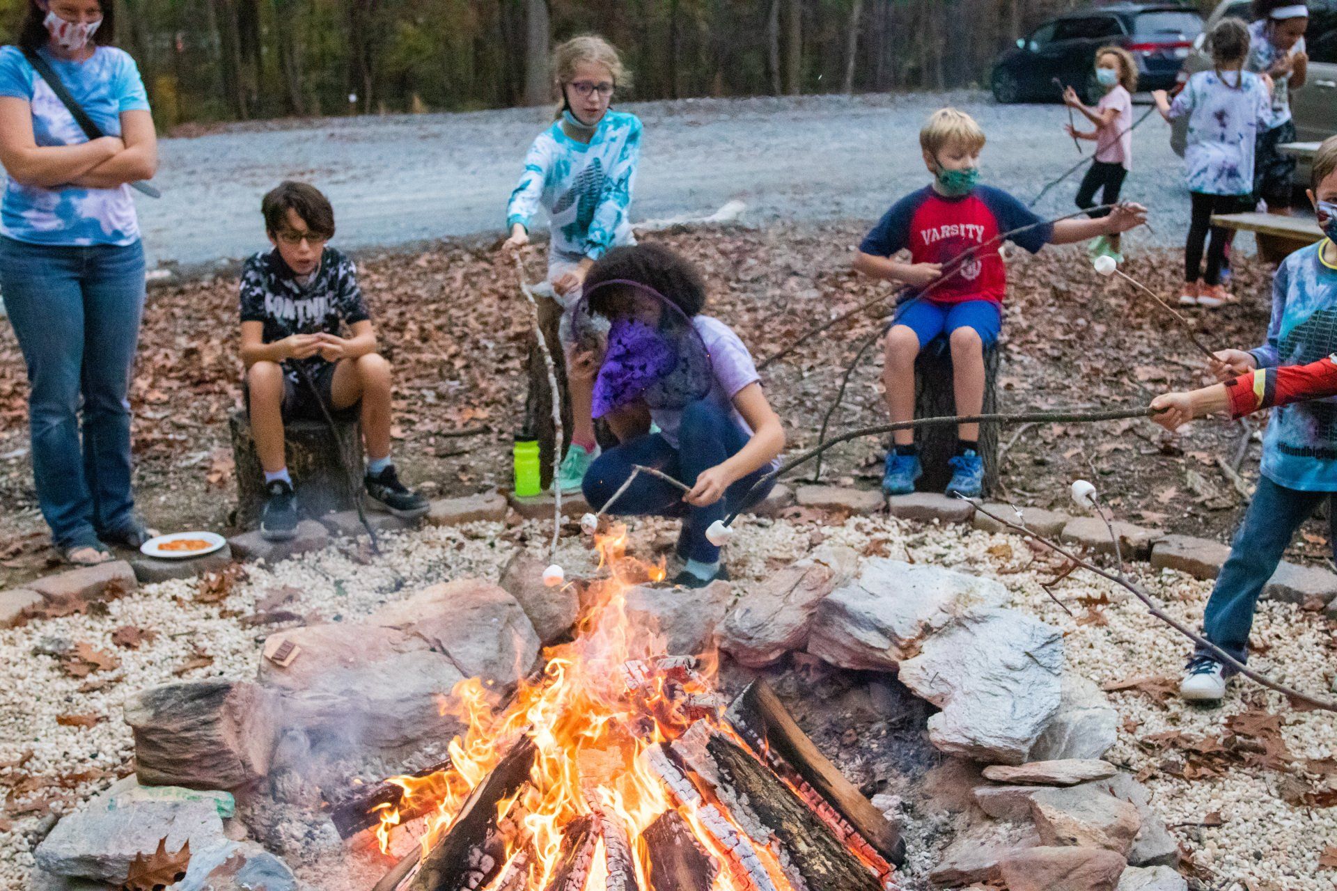 Fire Pit rental with children roasting smore's