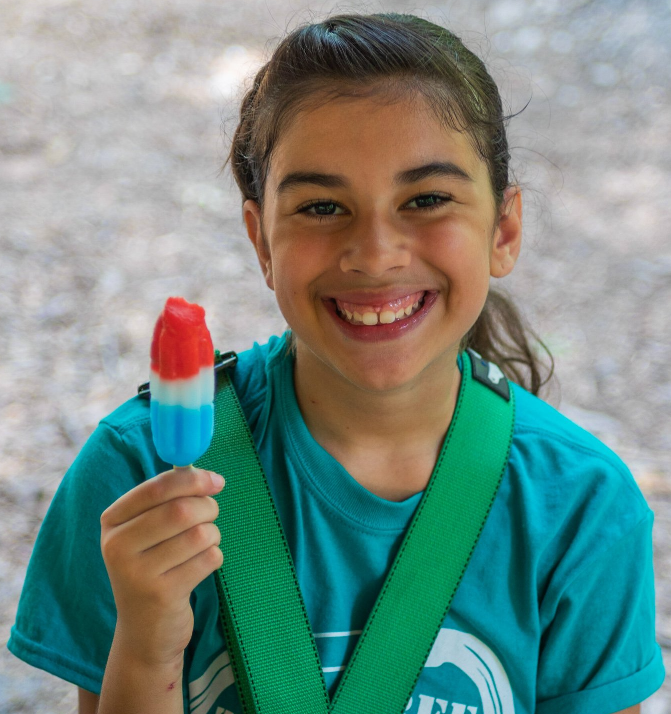 Young camper enjoying a popsicle