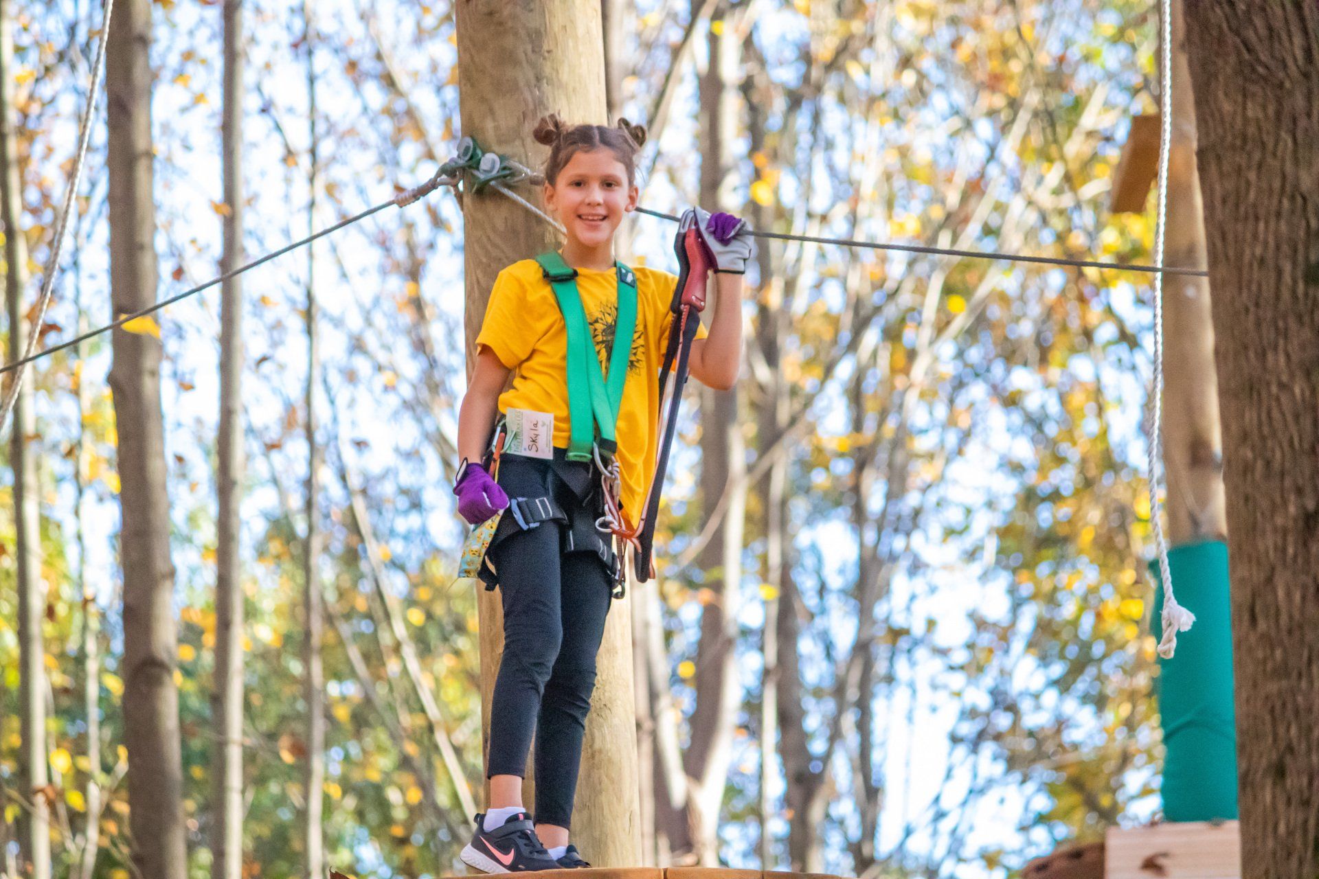 Camper climbing obstacle at Frederick Camp