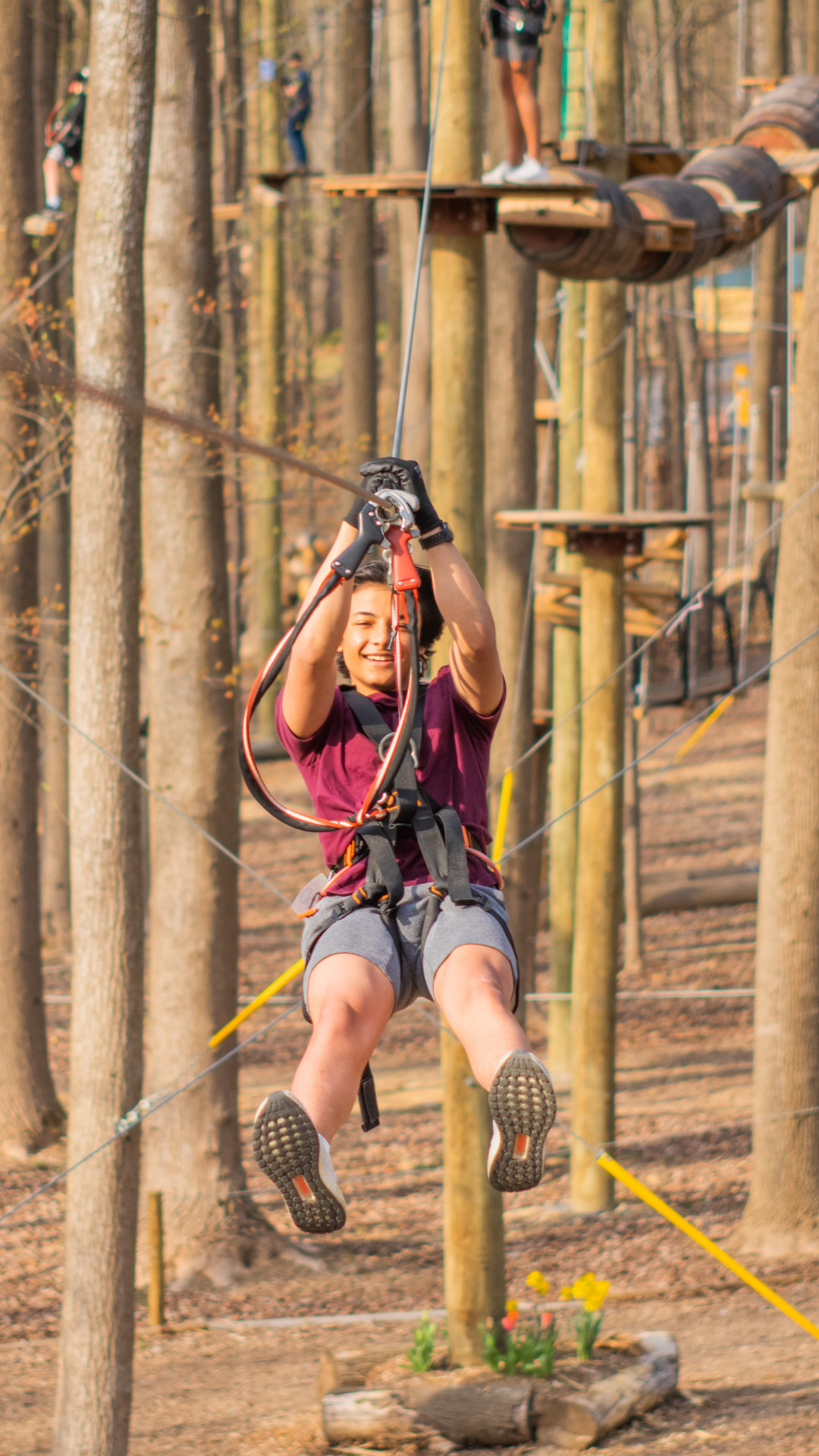 Adult male ziplining at Tree Trekkers