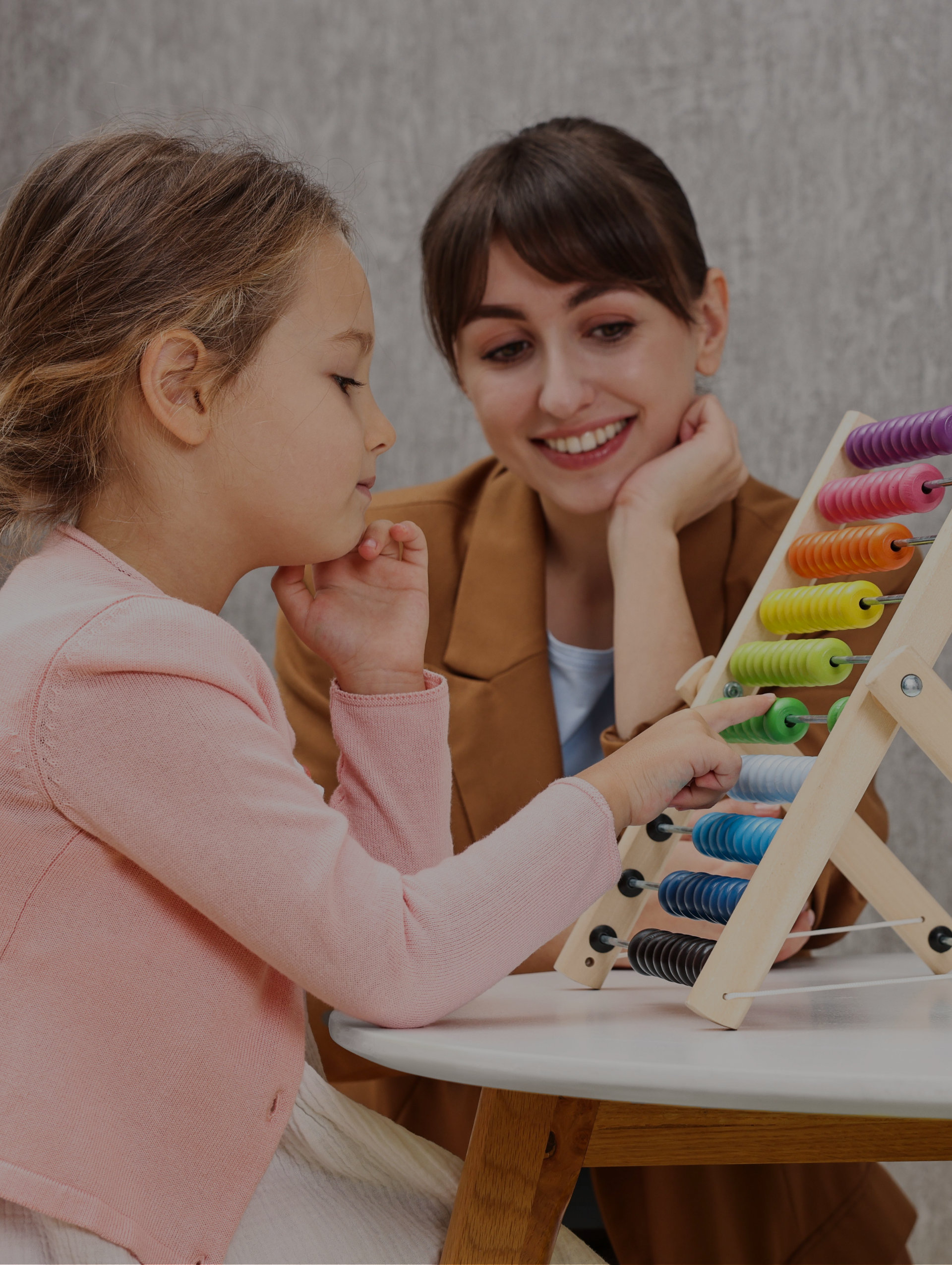 ABA therapist working with autistic child during therapy session with Positive Reinforcement PLLC