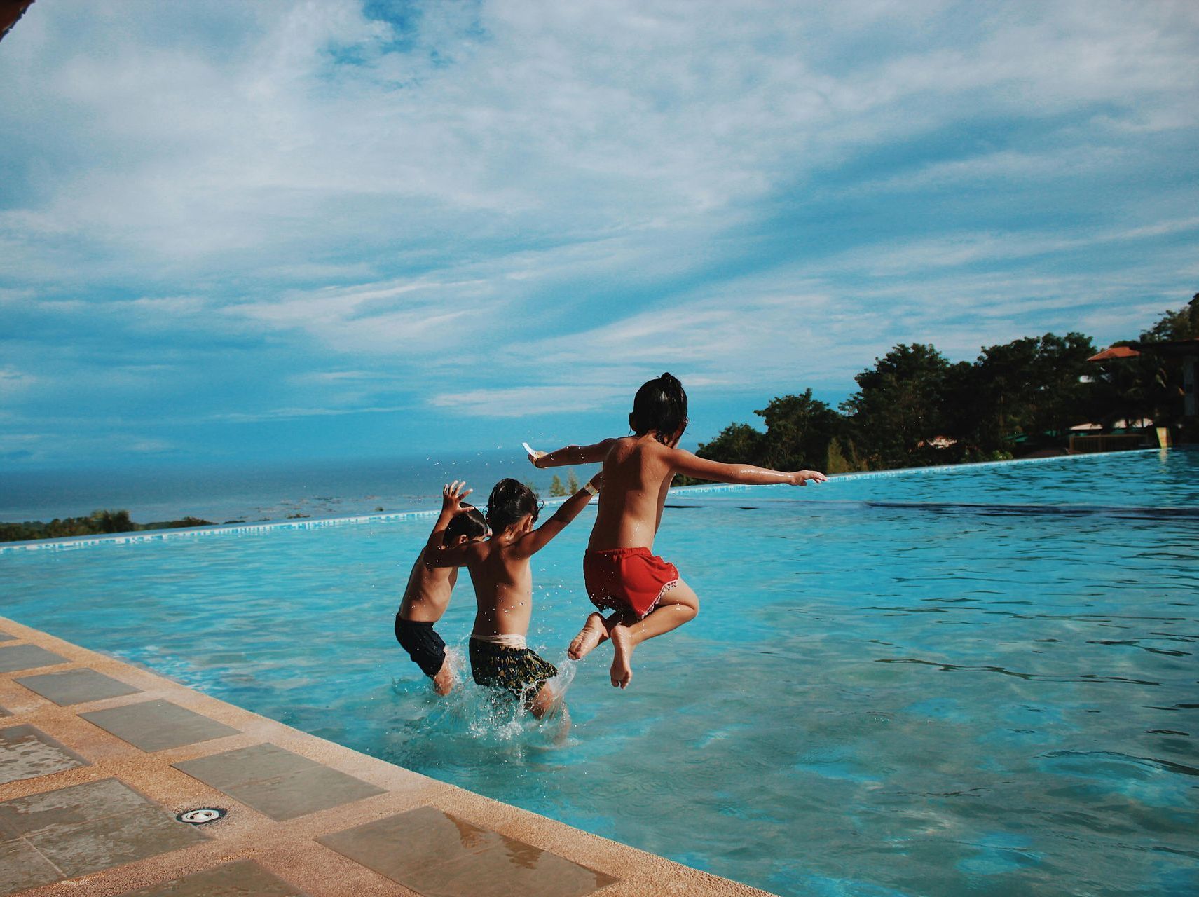 kids jumping in pool - ABA Therapy