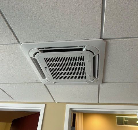 Ductless air condition in a drop ceiling.