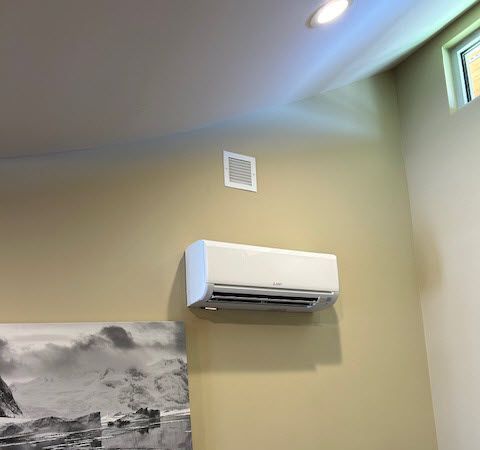 Ductless air conditioner on a wall.